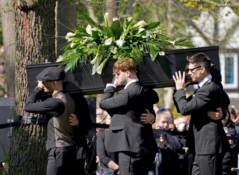 Max George (left) and Jay McGuiness of The Wanted (centre) carry the coffin at the funeral of their bandmate Tom Parker at St Francis of Assisi church in Queensway, Petts Wood, in south-east London, following his death at the age of 33 last month, 17 months after being diagnosed with an inoperable brain tumour. Picture date: Wednesday April 20, 2022. (Photo by Kirsty O'Connor/PA Images via Getty Images)