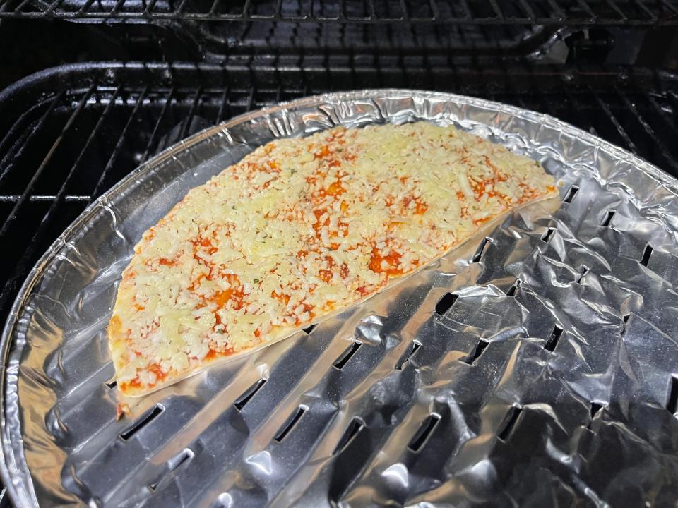 Pizza on foil on the grill