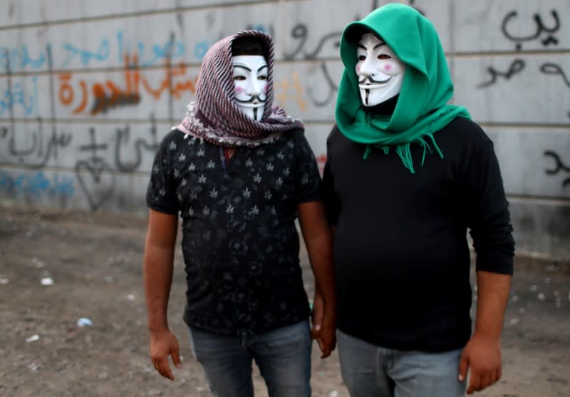 Iraqi demonstrators are seen during the ongoing anti-government protests in Baghdad