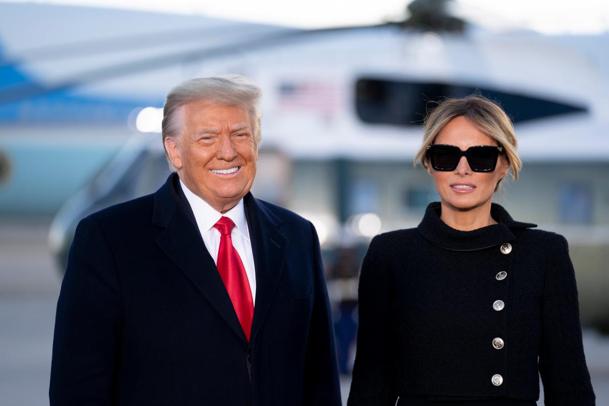 President Donald Trump, left, and First Lady Melania Trump arrive to a farewell ceremony at Joint Base Andrews (EPA)