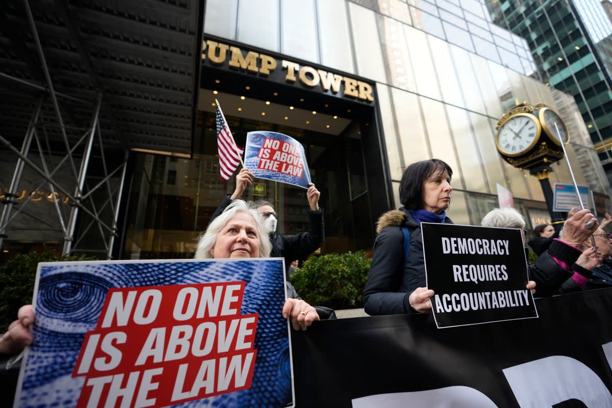 Protesters outside Trump Tower in Manhattan (AP)
