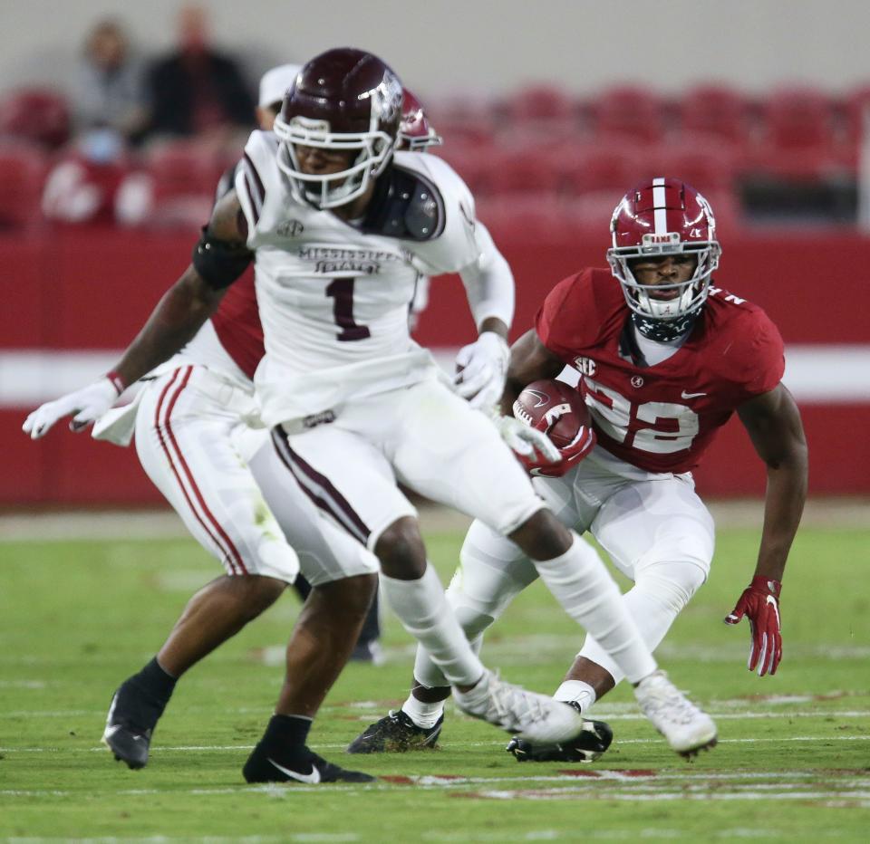 Oct 31, 2020; Tuscaloosa, Alabama, USA;  Mississippi State cornerback Martin Emerson (1) tries to turn away from a block as Alabama running back Najee Harris (22) runs the ball at Bryant-Denny Stadium. Mandatory Credit: Gary Cosby Jr/The Tuscaloosa News via USA TODAY Sports