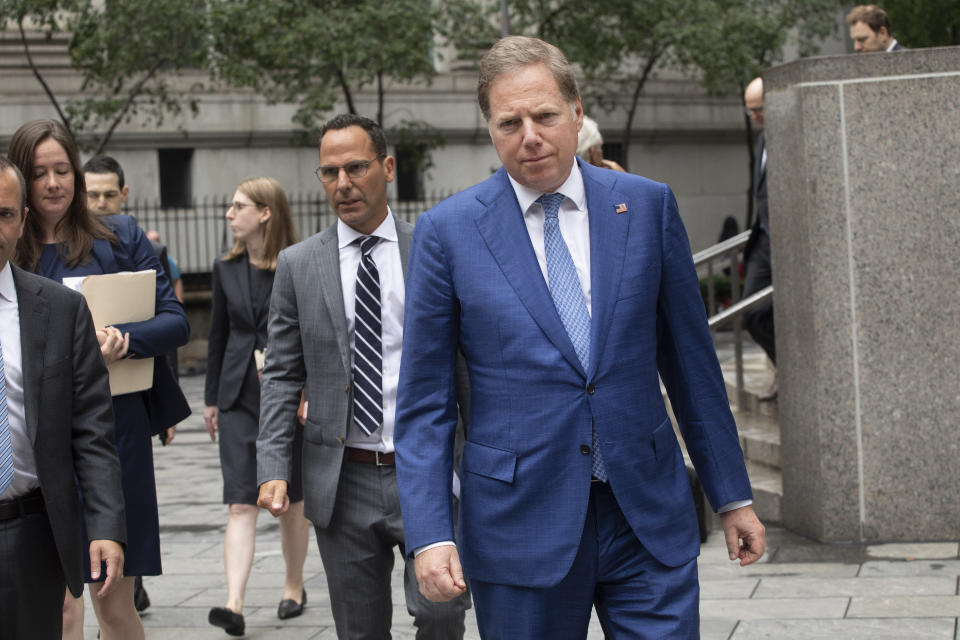 Geoffrey Berman, front, the United States Attorney for the Southern District of New York, leaves federal court in New York after a judge denied bail to Jeffrey Epstein, Thursday, July 18, 2019. (AP Photo/Mark Lennihan)