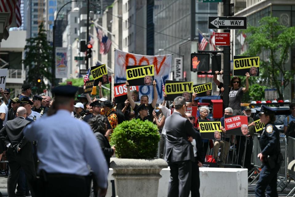 Anti-Trump demonstrators protest outside Trump Tower in New York on May 31. (AFP via Getty Images)