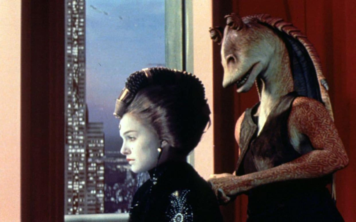 Jar Jar Binks, right, a character in the Star Wars franchise, is part of a long tradition of racial stereotypes when it comes to extraterrestrials, the study said - AFP