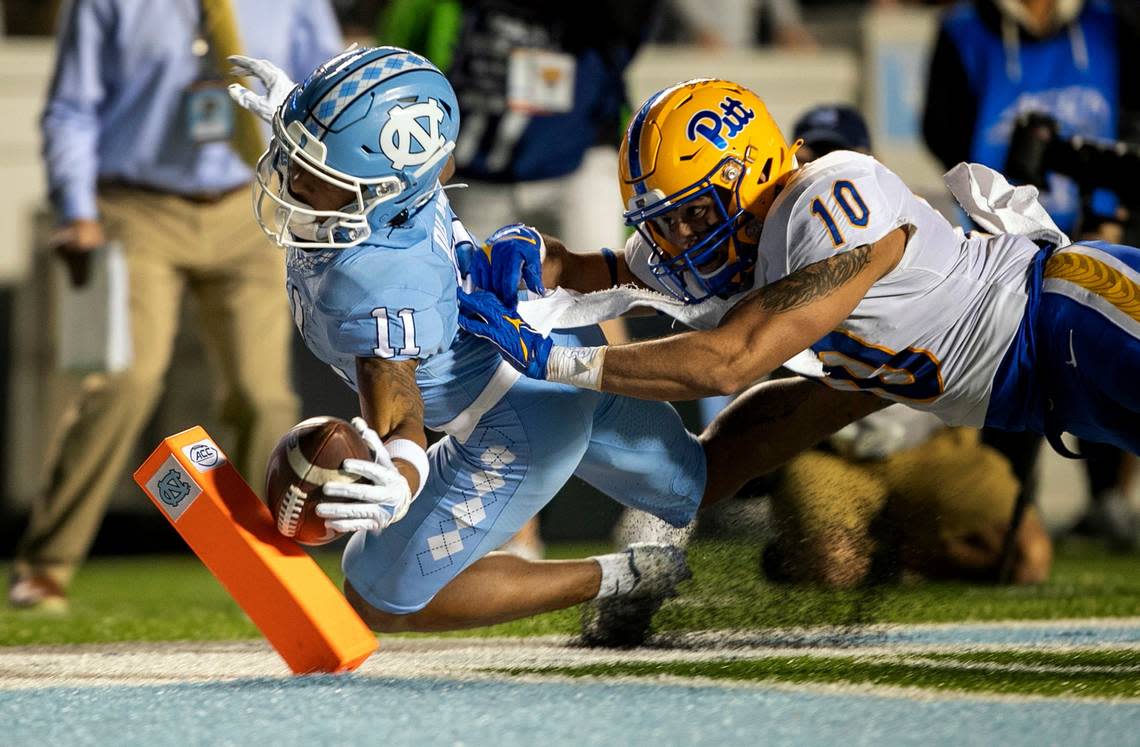 North Carolina’s Josh Downs (11) tries to score after a six-yard pass reception from quarterback Drake Maye in the second quarter against Pitt on Saturday, October 29, 2022 at Kenan Stadium in Chapel Hill, N.C. Downs was stopped on the one yard line by Pitt’s Tylar Wiltz (10).