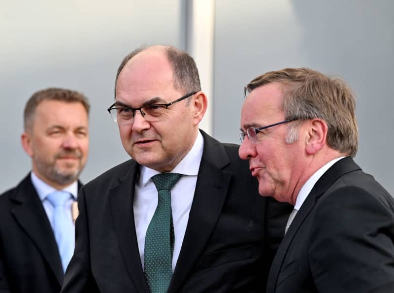 Boris Pistorius (R), German Minister of Defense, and Christian Schmidt (L), High Representative of Bosnia-Herzegovina, greet each other ahead of their meeting. Soeren Stache/dpa