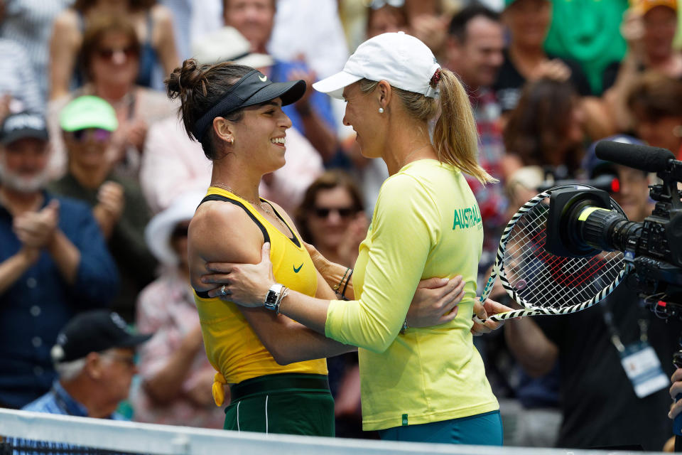 Australia's Ajla Tomljanovic, left, is hugged by Australian captain Alicia Molik after winning her match against France's Pauline Parmentier during their Fed Cup tennis final in Perth, Australia, Sunday, Nov. 10, 2019. (AP Photo/Trevor Collens)