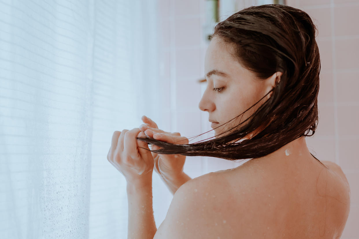 Woman washing her hair in the shower. (Getty Images)