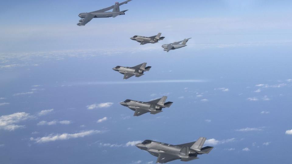 In this photo provided by South Korean Defense Ministry, A U.S. B-52 bomber, C-17 and South Korean Air Force F-35 fighter jets fly over the Korean Peninsula during a joint air drill in South Korea, Tuesday, Dec. 20, 2022. (South Korean Defense Ministry via AP)