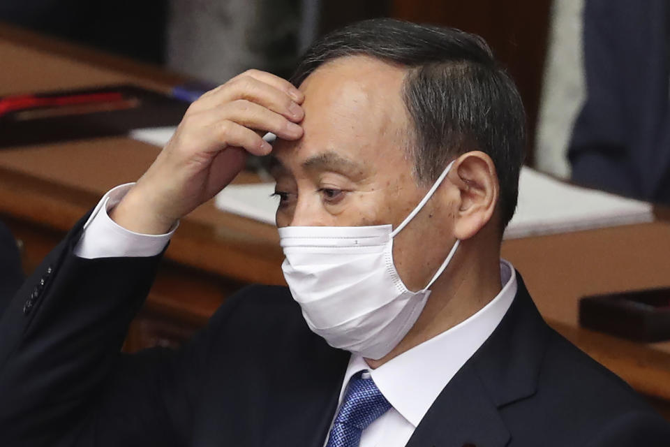 Japanese Prime Minister Yoshihide Suga attends an ordinary Diet session at the upper house of parliament in Tokyo, Monday, Jan. 18, 2021. (AP Photo/Koji Sasahara)