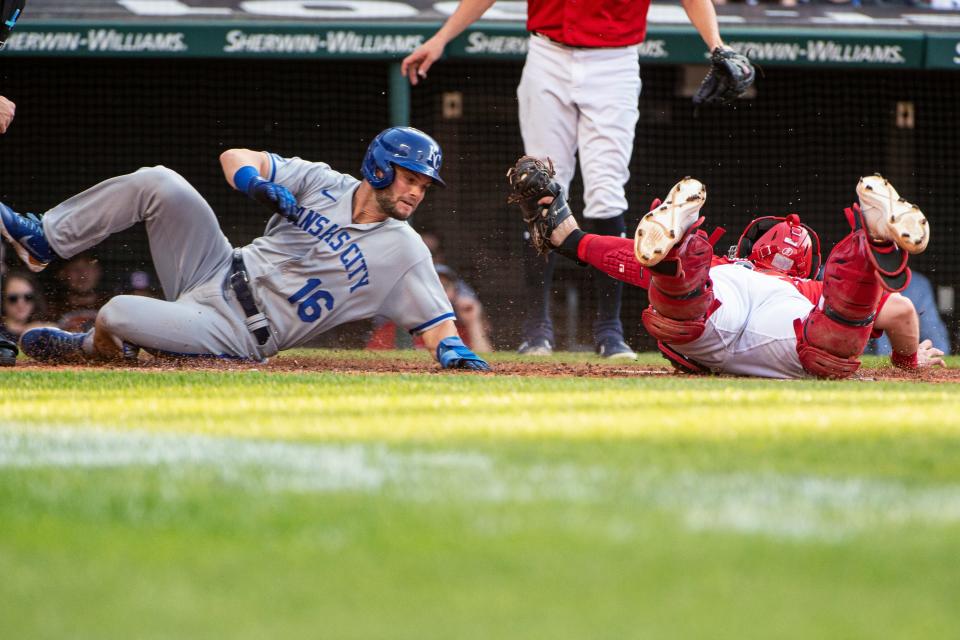 Guardians catcher Austin Hedges holds the ball after tagging out Andrew Benintendi of the Royals at home during the third inning in Cleveland, Tuesday, May 31, 2022. (AP Photo/Phil Long)