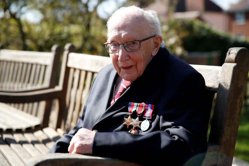 FILE PHOTO: Retired British Army Captain Moore walks to raise money for health workers