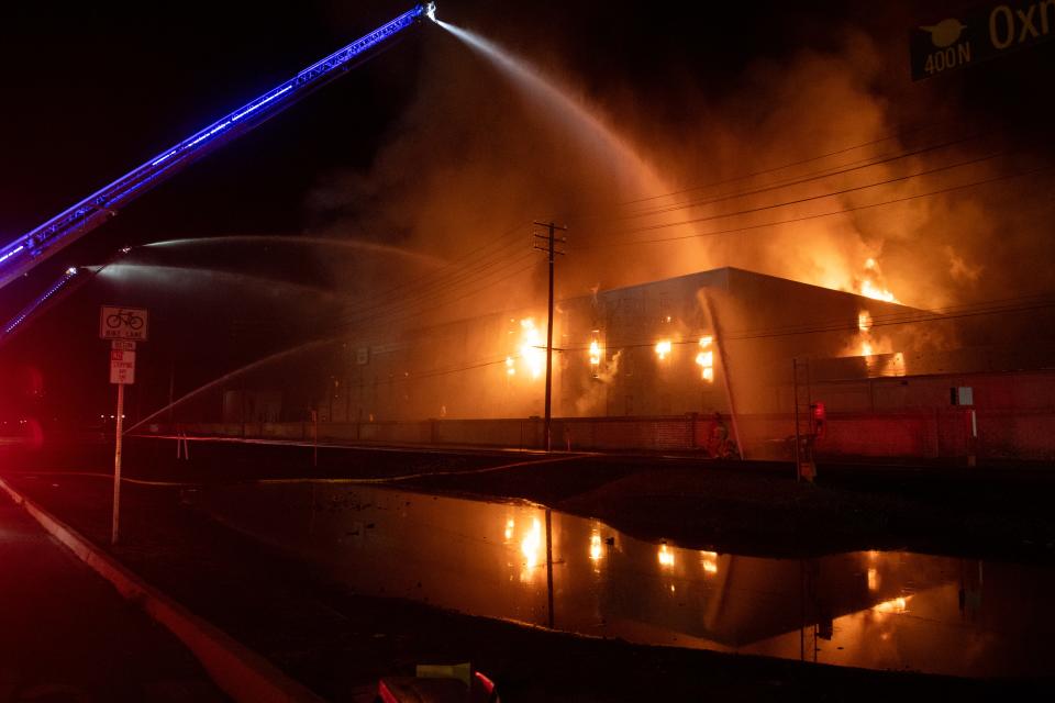 Flames engulf the former Sunkist warehouse building in Oxnard's La Colonia neighborhood late Tuesday. The building ultimately collapsed.