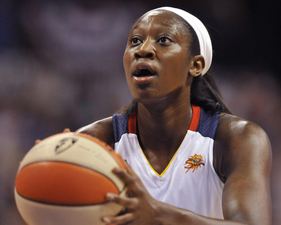 FILE - In a June 15, 2012, file photo Connecticut Sun's Tina Charles shoots a free throw in the first half of a WNBA basketball game against the New York Liberty in Uncasville, Conn. People familiar with the situation say the Connecticut Sun have agreed to trade Tina Charles to New York for players to be named later and the Liberty's first round pick in 2015. (AP Photo/Jessica Hill, file)