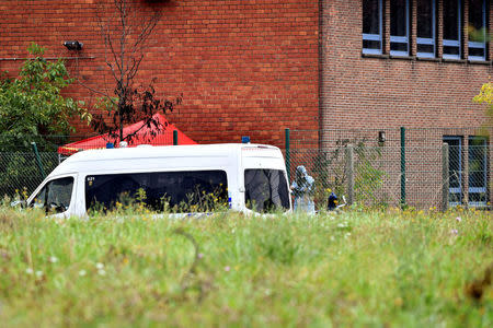 A police vehicle is seen inside the Belgium's National Institute of Criminology domain after arsonists set fire to it in Brussels, Belgium August 29, 2016. REUTERS/Eric Vidal