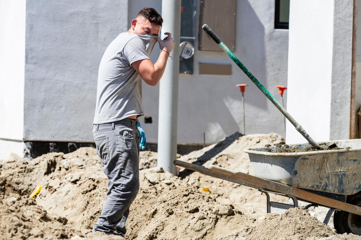 Miguel Nevarez of Highland wipes sweat from his face while working on new construction in Palm Springs, Calif., on September 22, 2021. Palm Springs recorded its hottest summer ever in 2021.