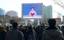 People watch a huge screen broadcasting the government's announcement in Pyongyang, North Korea, in this file photo released by Kyodo January 6, 2016. Mandatory credit REUTERS/Kyodo/Files