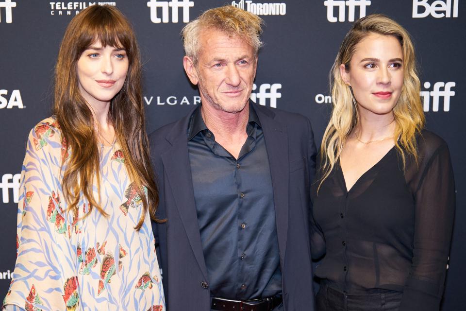 (L-R) US actress Dakota Johnson, US actor Sean Penn, and writer, director, and producer Christy Hall arrive for the premiere of 