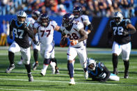 Denver Broncos running back Latavius Murray runs during the first half of an NFL football game between the Carolina Panthers and the Denver Broncos on Sunday, Nov. 27, 2022, in Charlotte, N.C. (AP Photo/Jacob Kupferman)