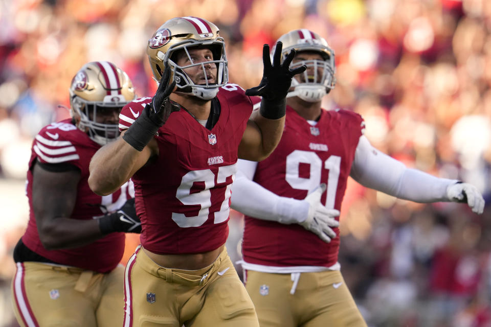 San Francisco 49ers defensive end Nick Bosa (97) and defensive end Arik Armstead (91) celebrate after sacking Dallas Cowboys quarterback Dak Prescott during the first half of an NFL football game in Santa Clara, Calif., Sunday, Oct. 8, 2023. (AP Photo/Godofredo A. Vásquez)