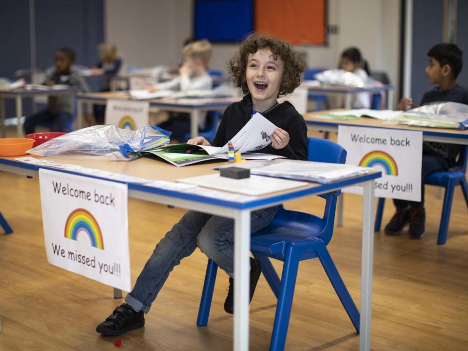 Children sit at individual desks during a lesson at the Harris Academy's Shortland's school on June 04, 2020: Getty Images