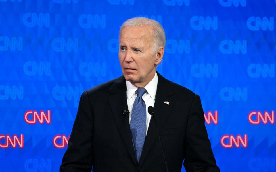 Joe Biden looks on as he participates in the first presidential debate of the 2024 elections