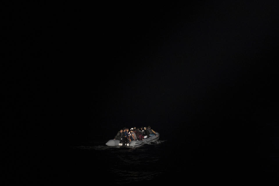 FILE - In this Thursday, Sept. 26, 2019 file photo, refugees and migrants in a dinghy are lit by a a Greek coast guard patrol boat's spotlight during a rescue operation near the eastern Aegean Sea island of Samos. A leading international medical charity said on Thursday, Nov. 2, 2023 that has received scores of testimonies over the past two years from migrants that point to a "recurring practice" of alleged secret, illegal and often brutal deportations back to Turkey from two eastern Greek islands. (AP Photo/Petros Giannakouris, file)