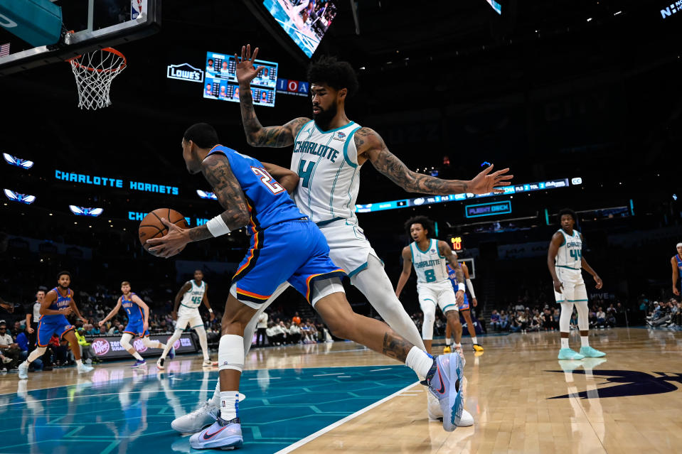 CHARLOTTE, NORTH CAROLINA – OCTOBER 15: Nick Richards #4 of the Charlotte Hornets defends Tre Mann #23 of the Oklahoma City Thunder during the second half of their game at Spectrum Center on October 15, 2023 in Charlotte, North Carolina. (Photo by Matt Kelley/Getty Images)