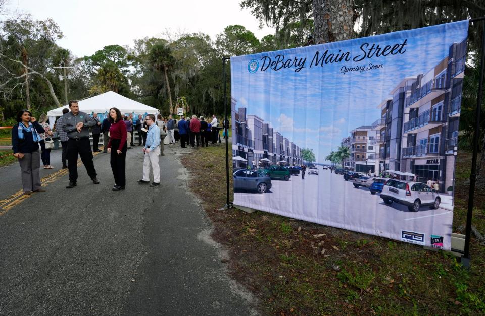 People gather at the DeBary Main Street project groundbreaking on Wednesday, Jan. 24, 2024.