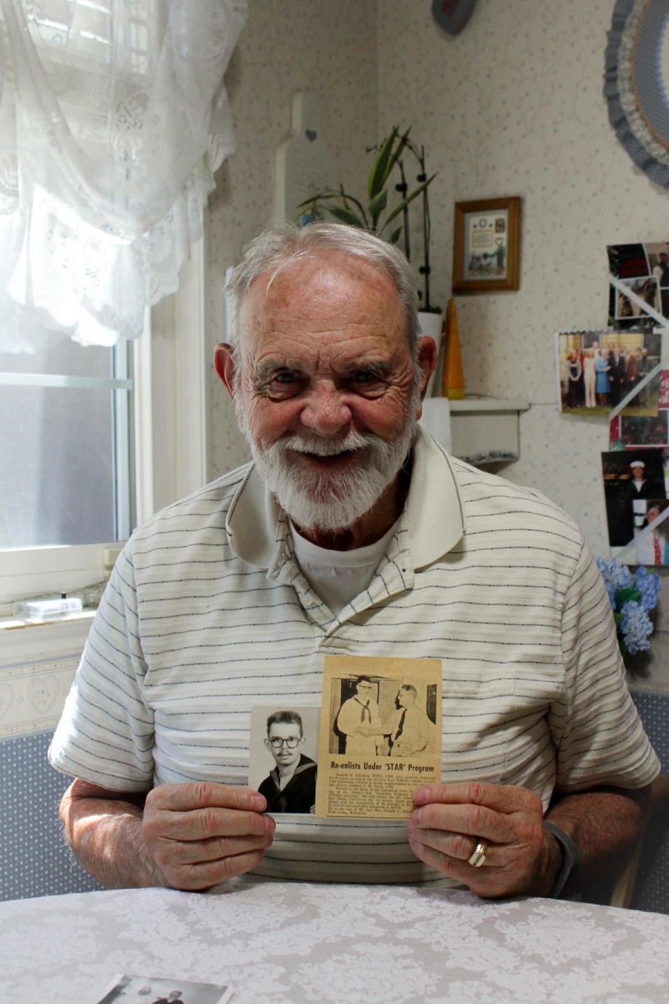 Inside of his Stockton home, veteran Richard Johnston shares a photograph and an old newspaper article about his experiences in the Army on Thursday, Sept. 7, 2023.