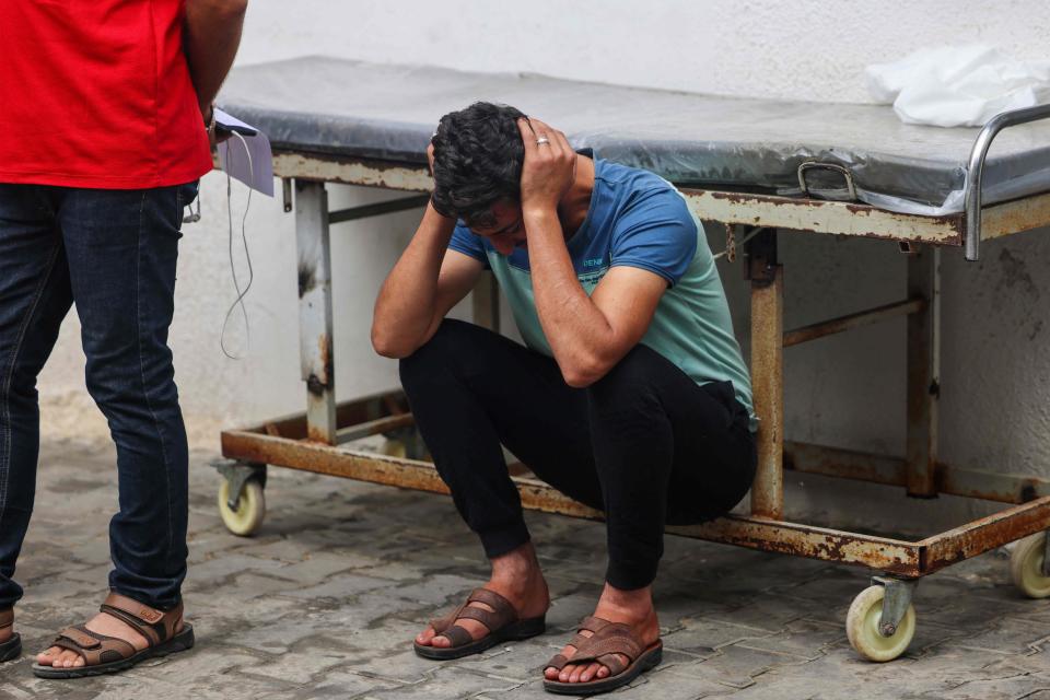 A relative mourns loved ones killed during overnight strikes on Rafah in the southern Gaza Strip, at Al-Najjar hospital on November 12, 2023, amid the ongoing battles between Israel and the Palestinian militant group Hamas.