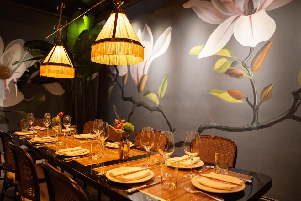 Le Colonial's private dining room features handpainted murals by Swedish artist Jonas Wickman.