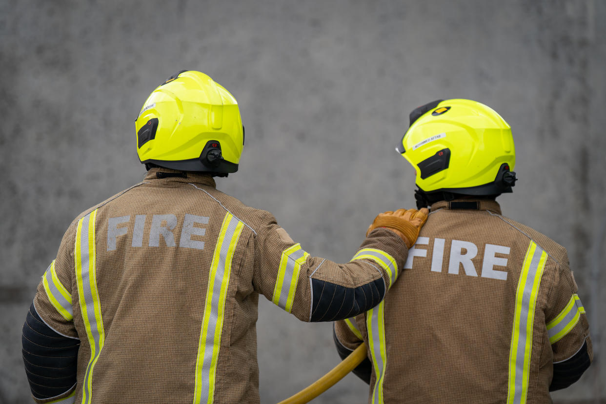 New London Fire Brigade recruits go through their paces during a drill at a Fire station in East London. Wednesday. Picture date: Thursday July 21, 2022.