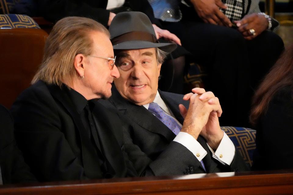 Bono and Paul Pelosi, speak in the First Lady’s box prior to President Joe Biden speaking during the State of the Union address from the House chamber of the United States Capitol in Washington.