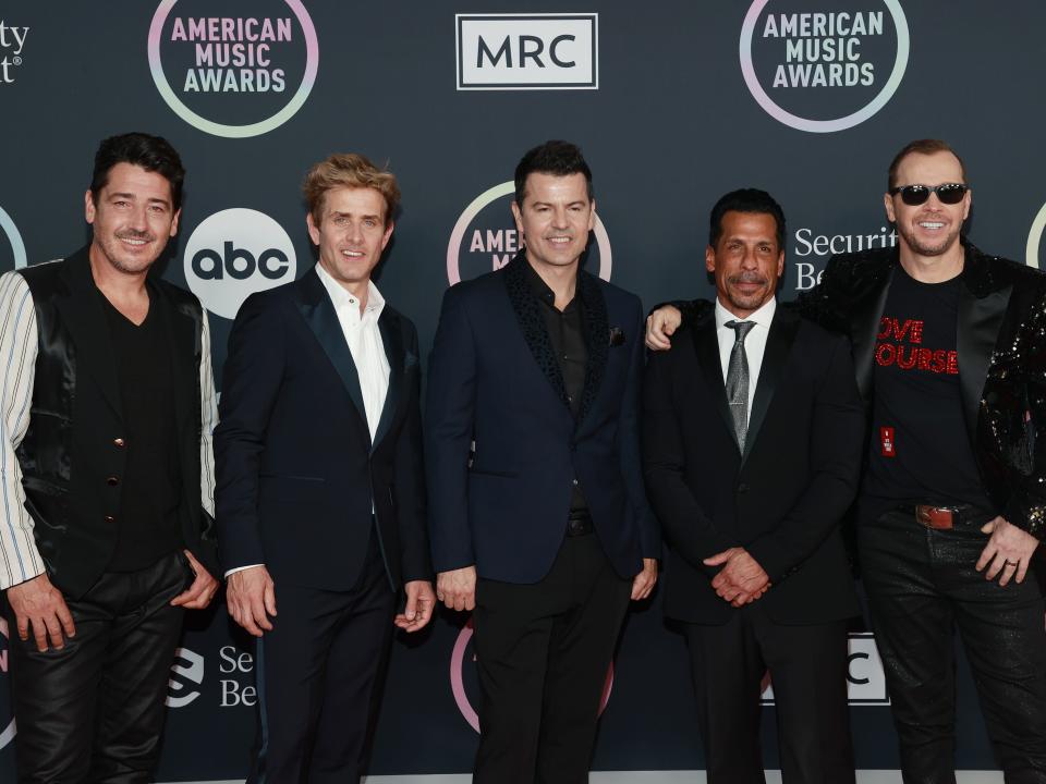 Jonathan Knight, Joey McIntyre, Jordan Knight, Danny Wood, and Donnie Wahlberg of New Kids on the Block attend the 2021 American Music Awards at Microsoft Theater on November 21, 2021 in Los Angeles, California.