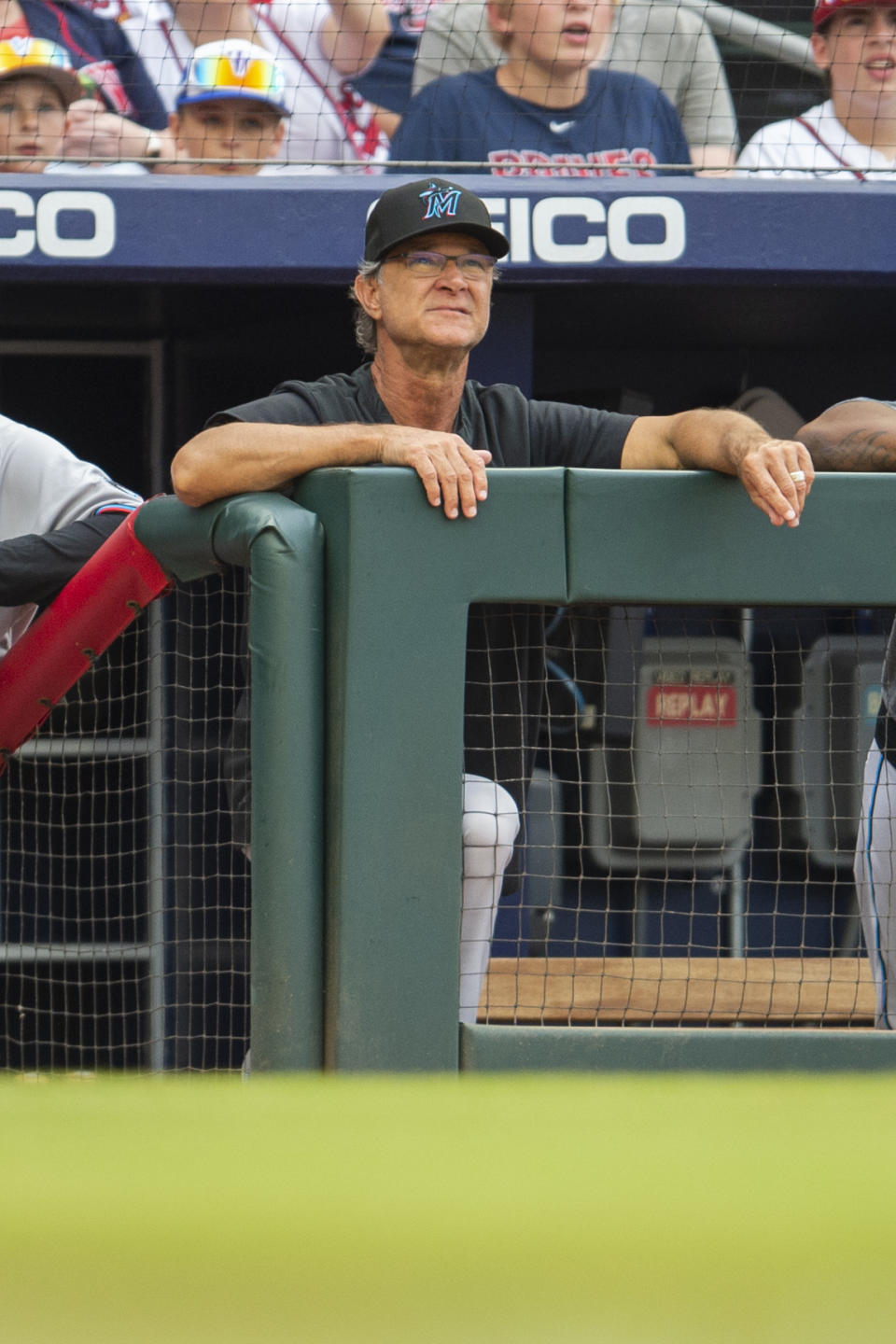Miami Marlins manager Don Mattingly watches from the dugout in the first inning of a baseball against the Atlanta Braves, Sunday, Sept. 4, 2022, in Atlanta. (AP Photo/Hakim Wright Sr.)