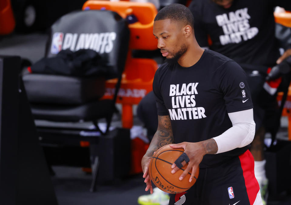 Damian Lillard #0 of the Portland Trail Blazers warms up with tape on his finger.