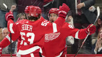 Detroit Red Wings center Joe Veleno, right, celebrates his goal against the Edmonton Oilers in the second period of an NHL hockey game Tuesday, Feb. 7, 2023, in Detroit. (AP Photo/Paul Sancya)