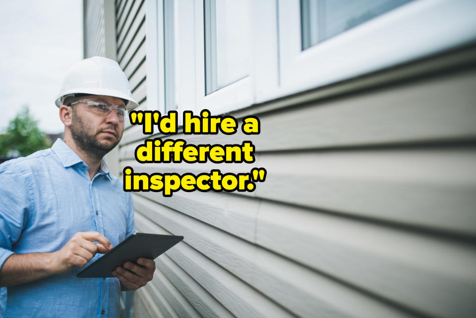 inspector looking at the exterior of a house