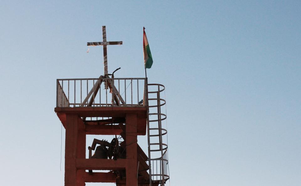Peshmerga put the cross back up on the Batnay church when the liberated it in October. (Photo: Ash Gallagher for Yahoo News) 