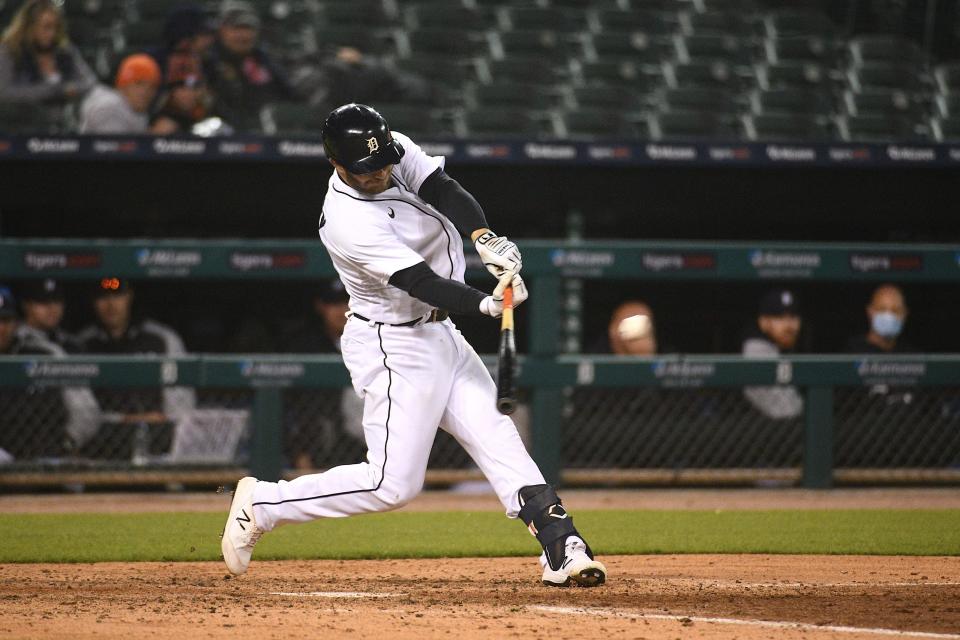 Detroit Tigers left fielder Robbie Grossman (8) hits a three-RBI triple during the fifth inning against the Kansas City Royals at Comerica Park, May 11, 2021.