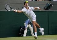 Novak Djokovic of Serbia hits a shot during his match against Kevin Anderson of South Africa at the Wimbledon Tennis Championships in London, July 6, 2015. REUTERS/Suzanne Plunkett - RTX1JAP5