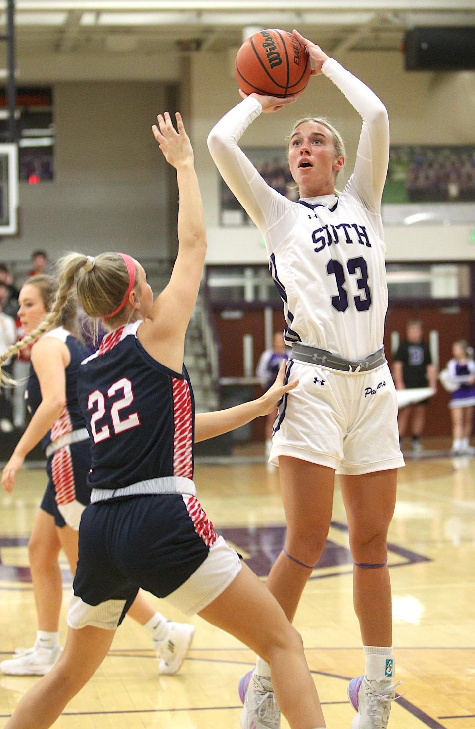 Bloomington South's Abbie Lucas fires a turnaround jumper over Bedford North Lawrence's Mallory Pride in their girls' basketball game on Tuesday, Nov. 15, 2022.