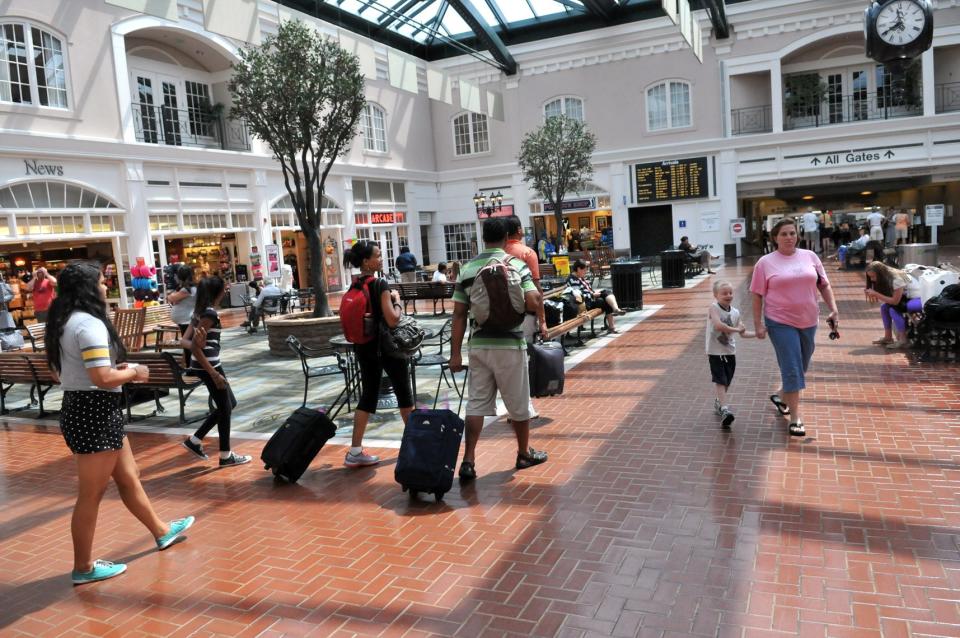 Passengers walk through the terminal as they head to their gate at Savannah Hilton Head International Airport.