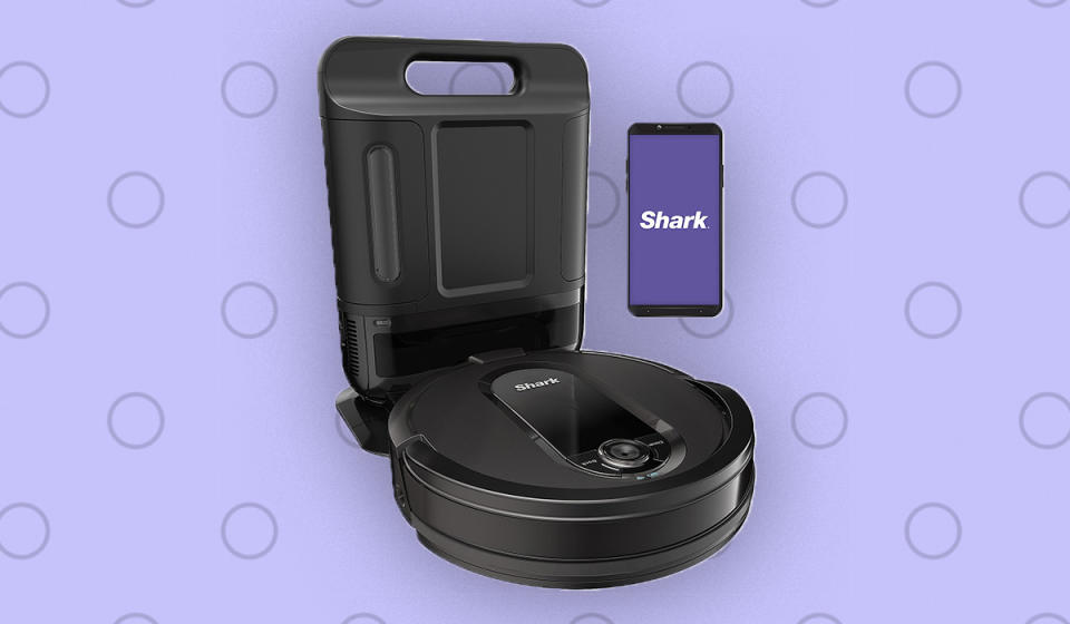 The Shark IQ robot vac automatically empties its own dust bin into the bagless charging base. (Photo: QVC)