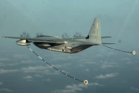 A KC-130 Hercules with Marine Medium Helicopter Squadron 364 (Rein.), 15th Marine Expeditionary Unit, prepares to refuel a CH-53E Super Stallion during air refueling training in the U.S. 5th Fleet area of responsibility, March 14, 2013. Picture taken March 14, 2013 U.S. Marine Corps photo by Cpl. John Robbart III/Handout via REUTERS/Files