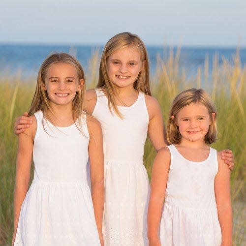 Maddie McCoy with her sisters before her diagnosis of  Rhabdomyosarcoma, or RMS, a very rare form of childhood cancer.