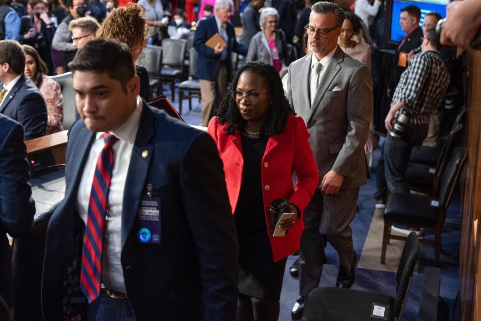 Supreme Court nominee Ketanji Brown Jackson, center, leaves for a lunch break on the second day of her confirmation hearing with her husband, Dr. Patrick Jackson, Tuesday, March 22, 2022, during a break in the Senate Judiciary Committee hearing on Capitol Hill in Washington.