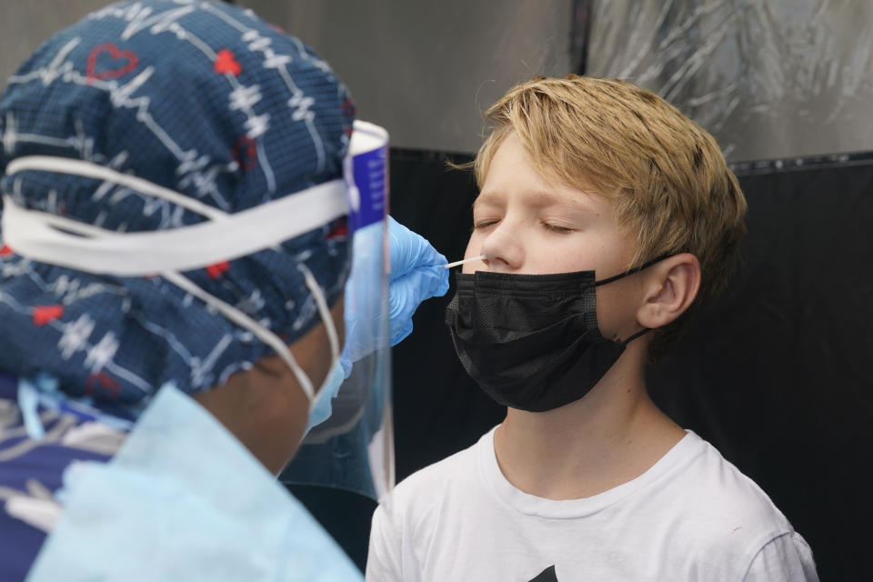 Jonathan Pagliarulo, 11, from Florida, gets tested for COVID-19, after vaccinated family members tested positive for the virus, Monday, Aug. 9, 2021. Source: AP/Marta Lavandier